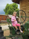 Masha on a tractor